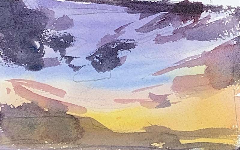 Paint a simple sunset scene with watercolors